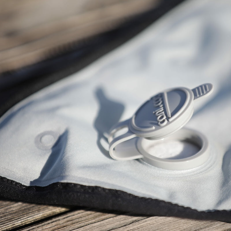 Inflatable boat with a visible brand logo on a wooden surface